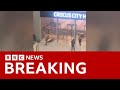 Moscow attack: Video captures gunmen storming concert hall and shooting dozens dead | BBC News