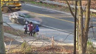 Mother saves her children from a speeding car passing a school bus