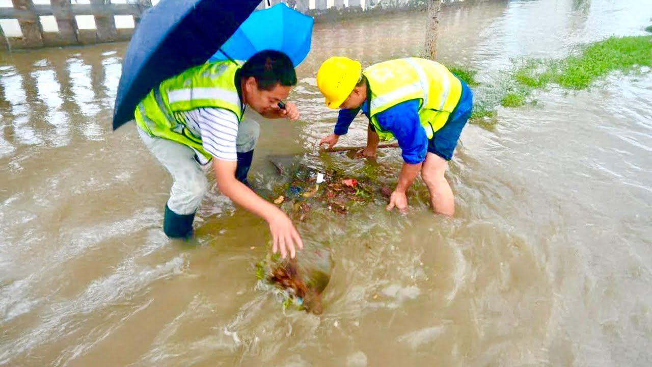 Unclogging Storm Drains A Street Flooding Rescue! - YouTube