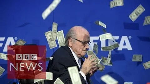 Moment Sepp Blatter was showered with fake dollar bills - BBC News - DayDayNews