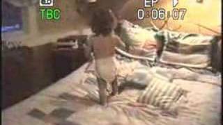 cute two year old baby falls off bed