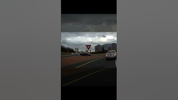 Wrong Way Driver Yields in Roundabout—Near Accident!