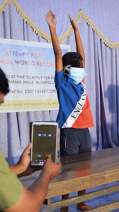 Fastest time to apply 10 surgical masks blindfolded - 11.56 seconds by Josukutty Ebin 🇮🇳