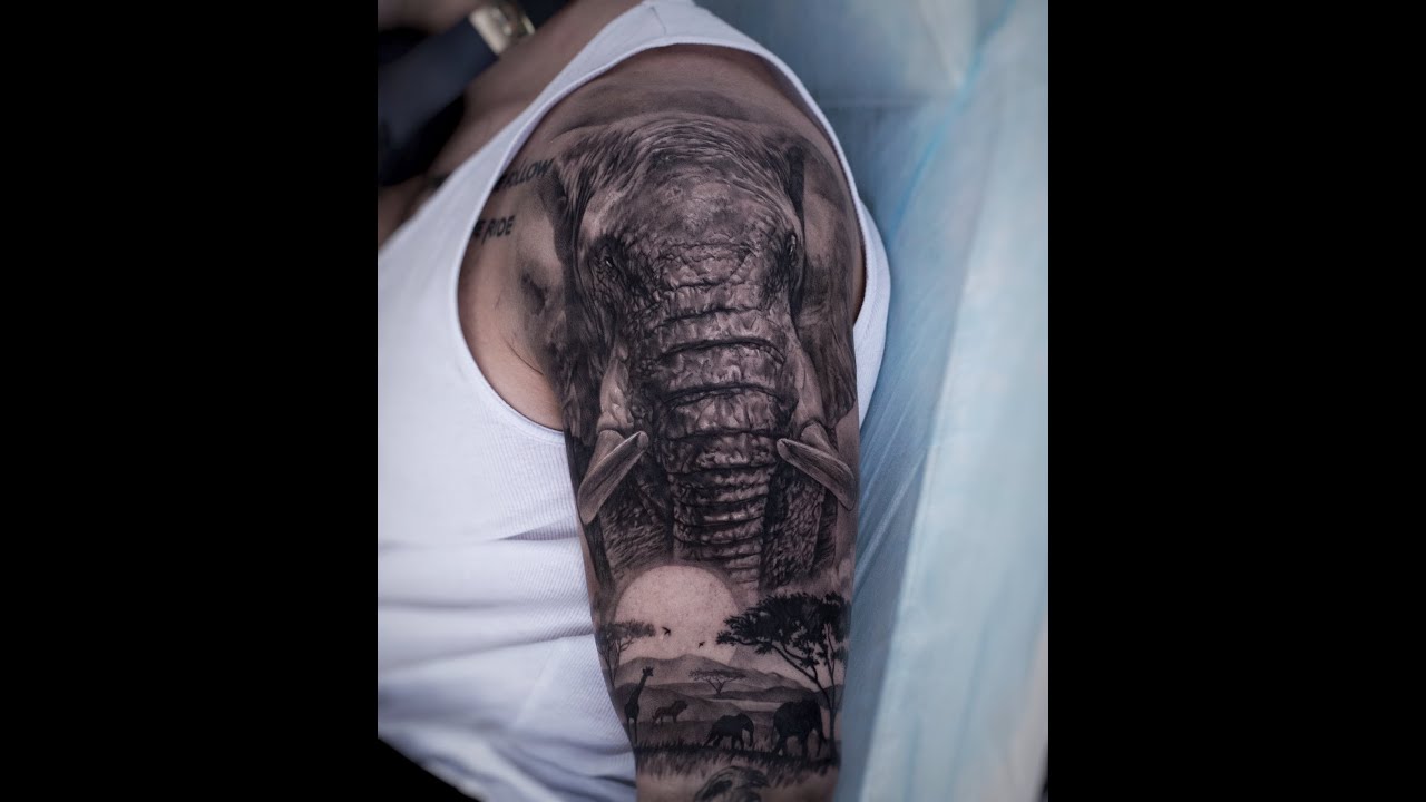 Black Ink Dali Elephant Tattoo On Left Leg Calf