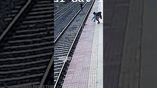 Man Rescues Boy After Falling On Train Tracks In India