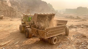 Heavy Equipment in Action | CAT Machine Loading Giant Rocks