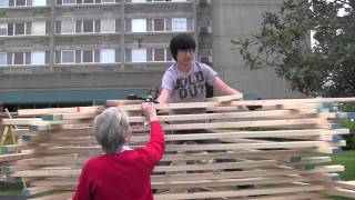 Lee & Betty Benson talk about their sculpture The Stage that New Albany Built
We hope you will enjoy this short video interview with Lee and Betty Benson. The pair, who has produced work from the Dakotas to Australia, created the 2013 New Albany Public Art Project installation, The Stage that New Albany Built at Riverview Towers at Scribner and Elm Streets in New Albany. Hailing from Jackson, Tennessee Lee and Betty maintain two studios that produce large-scale architectural sculptures as well as figurative, narrative monoliths in mixed media, stone, timber, wood, clay, and 24K gold. In 2005 they combined their four earned degrees and 30 years of experience of creating public sculpture to form Benson Sculpture LLC. Over the years their blend of talents and skills have allowed them to build the family business into a formidable sculpture enterprise. Today, Benson Sculpture has a symbiotic relationship with Habitat for Humanity (and its international counterpart) to donate materials used in their temporary sculptures to be recycled into homes for low-income families. Learn more about Benson Sculpture at: http://www.uu.edu/personal/lbenson
Lee and Betty Benson will be at Riverview Towers, the site of their art installation, The Stage that New Albany Built to talk with the public during the New Albany Public Art Walk on Saturday, June 22, 2013, 6-9pm. And, the public is invited to an extra chance to learn about Lee and Betty Bensons experiences developing sculptural installations during a talk on Friday, June 21 from 6-7 pm at the Carnegie Center for Art & History. Learn more about the New Albany Public Art Project at: www.napublicart.org Lee & Betty Benson talk about their sculpture The Stage that New Albany Built