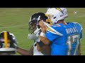 Philip rivers grabs hold of mike hilton after interception