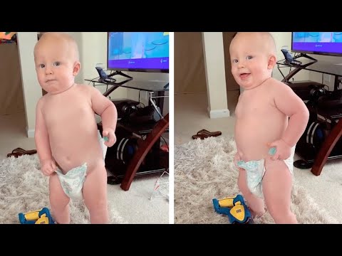Cheeky Baby Tries To Take His Diaper Off