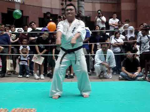 singapore budokan kyokushin karate demo (part 5)-standing on eggs while breaking brick