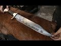 Forging a San Mai Bowie knife, the complete movie.