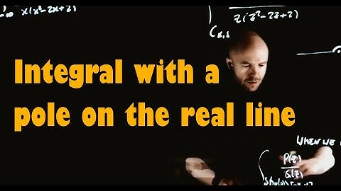 An integral of function with a pole on the real line via the residue theorem