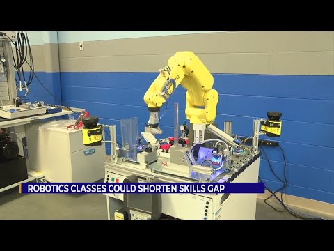 TCAT instructor introduces robotics and manufacturing to students.