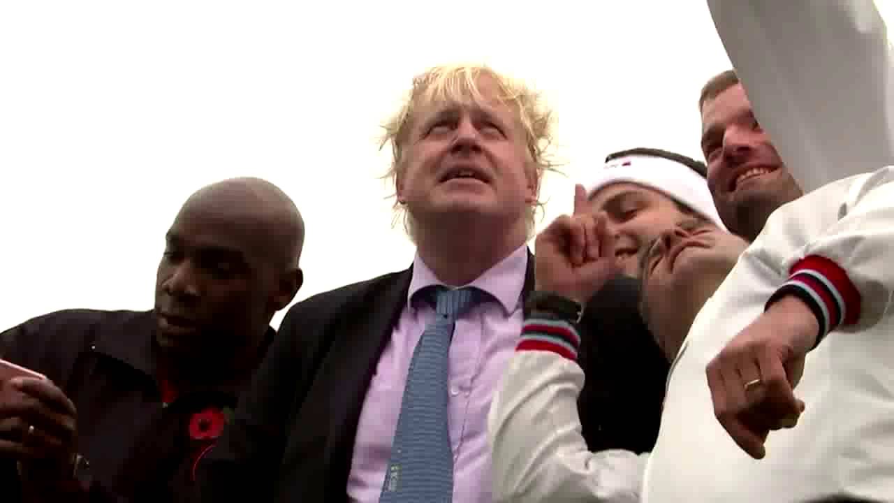Watch moment Boris Johnson takes a tumble in tug of war contest to launch Poppy Day