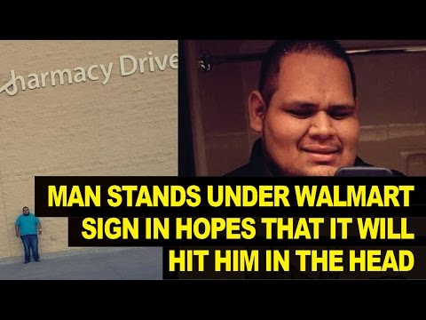 Man Stands UNDER Loose Walmart Sign, Hopes of Lawsuit