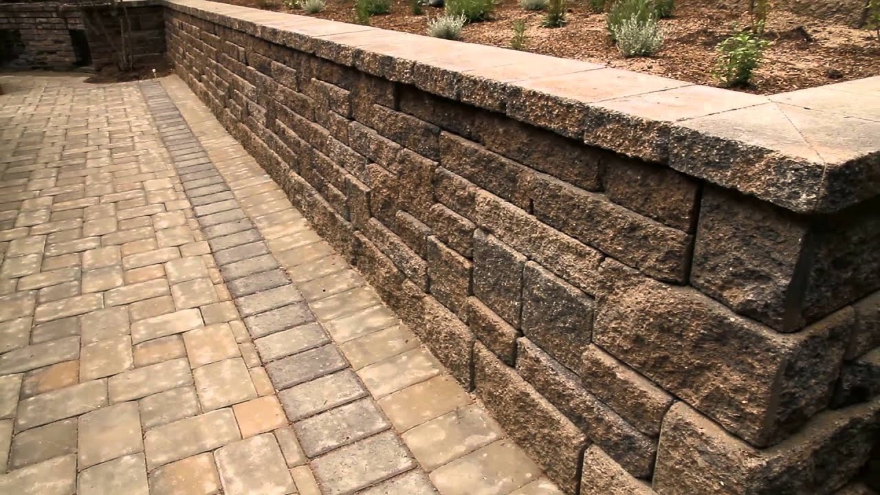 Europa Allan Block Retaining Wall With Concrete Permeable Paver Patio