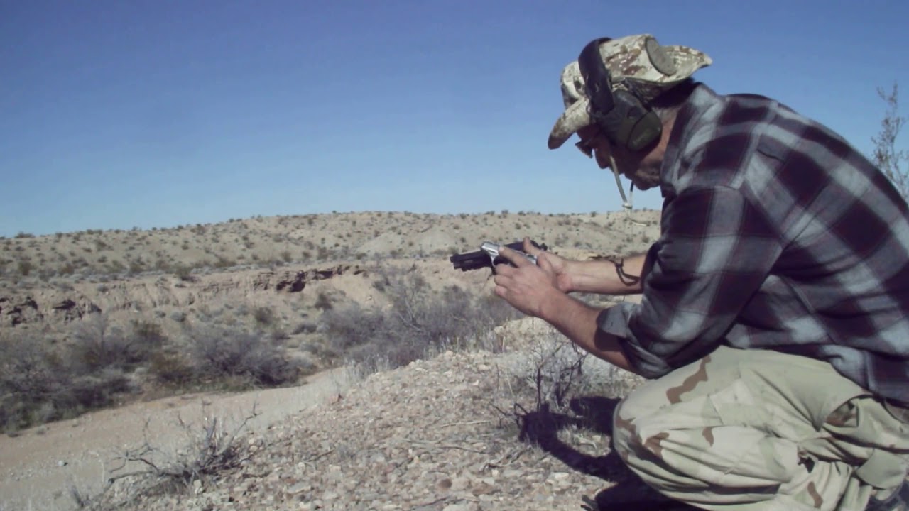 Taurus pt 100 40cal 150 yards low and to the left but phoenix hp22 hits plate