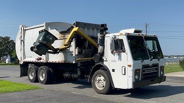 Mack LEU EZ-Pack Hercules side loader garbage truck in Rehobeth Bay