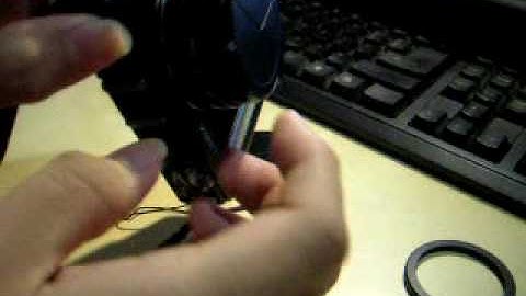 Installing a Ricoh LC1 lens cap onto a Panasonic LX3