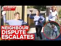 Crew dodge projectiles after neighbour's fence fight escalates | A Current Affair