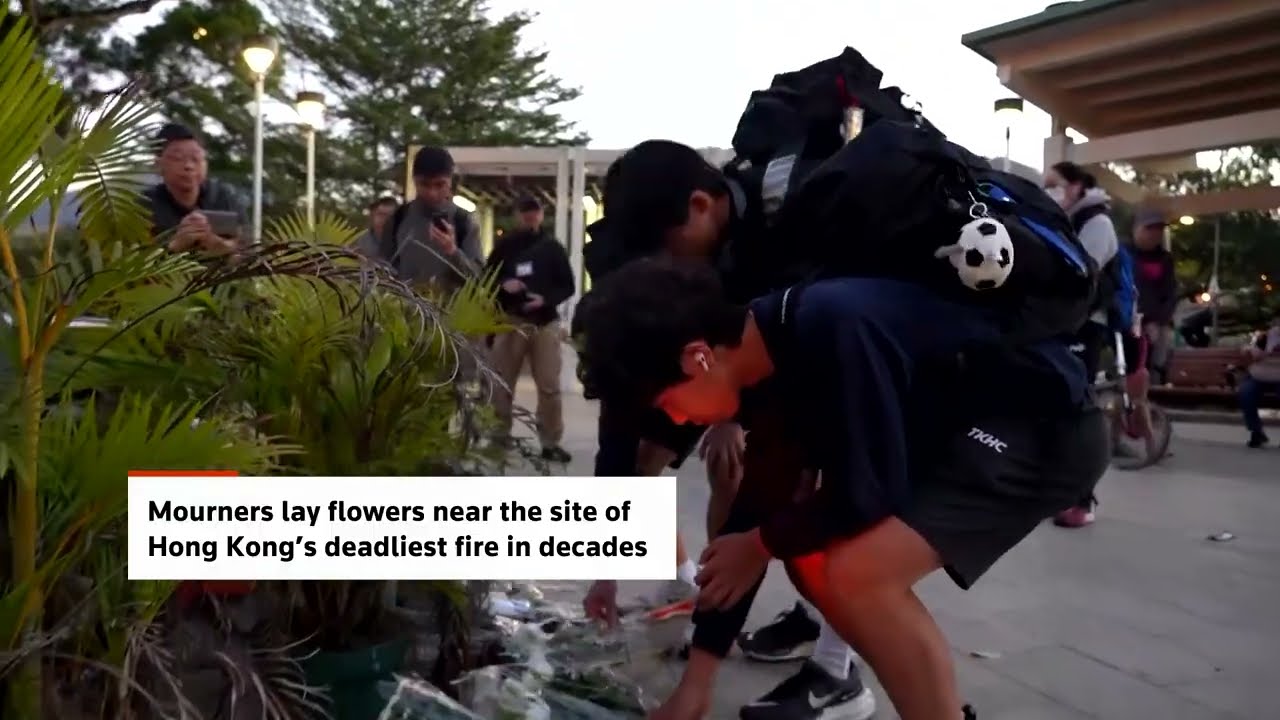 Hong Kong residents lay flowers for victims of deadly fire | REUTERS