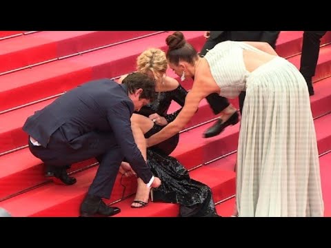 Cannes: 'Sybil' cast help Virginie Efira with her shoes