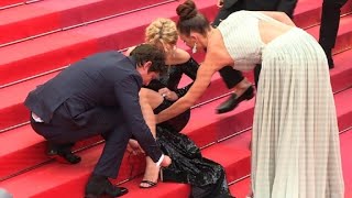 Cannes: 'Sybil' cast help Virginie Efira with her shoes