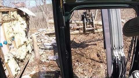 Bobcat e42 mini excavator pulling stumps & clearing land