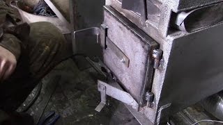 Alteration of the door on the stove burzhujku