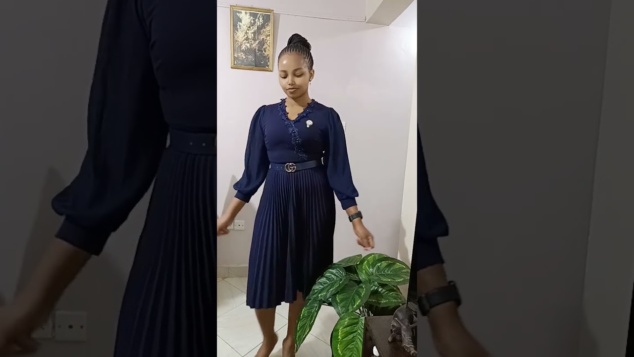 Pleated Official Dress With a Belt and a Broach