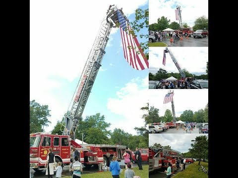 Monsey FD raising the flag at Chaverim Kids Safety Day at Viola Park