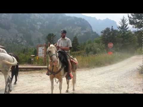 Mark riding to trail head on horse at Granite Peak