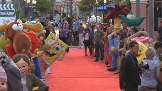 Universal Orlando characters greet attendees on the red carpet at private party