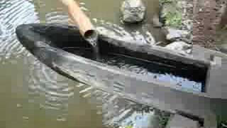 Water-powered rice-pounding mortar