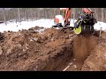 Screening dirt into a trench