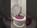 Going under in worlds largest toilet surprise egg pool shorts