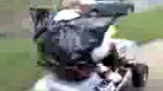 Redneck on lawntractor with garbage bag