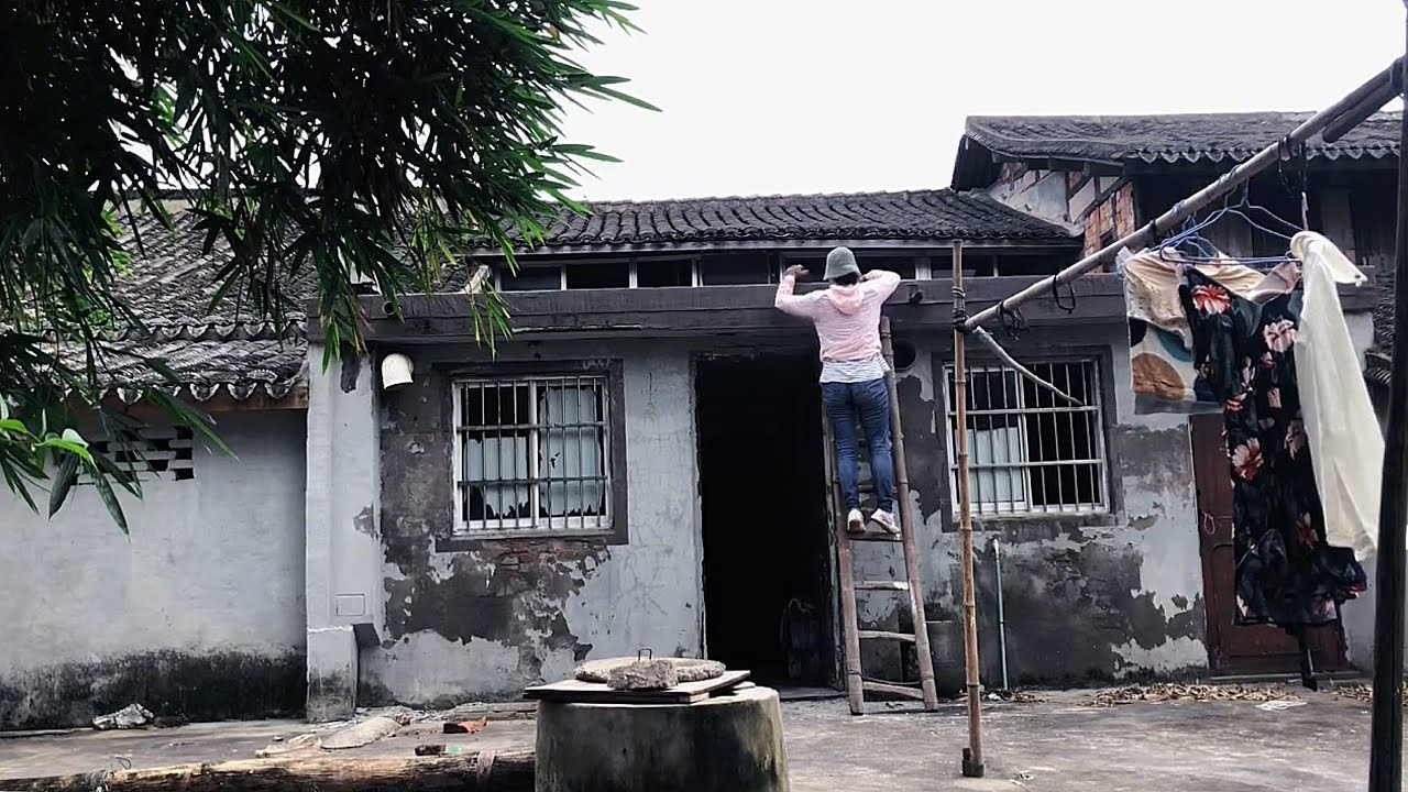 Young girl with friends renovating old house, great transformation