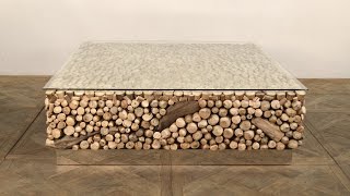 Avant Garde Driftwood Coffee Table with Stainless Steel Base and Glass Top.