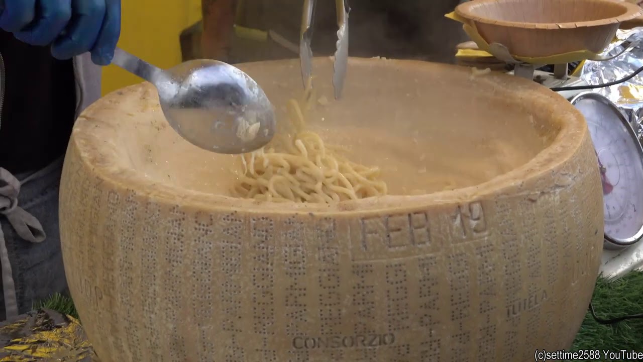 Italian Truffle Pasta in Real Parmigiano Cheese Wheel. London Street