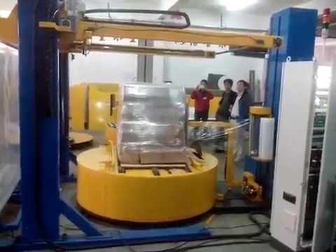 Automatic turntable pallet wrapping machine with top sheet convering