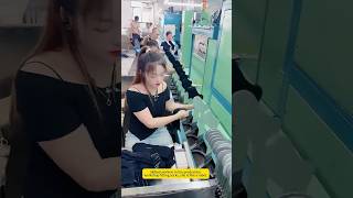 Skilled Workers In The Production Workshop Fitting Socks, She Is Like A Robot.