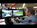Nigel Mansell playing F1 racing video game
