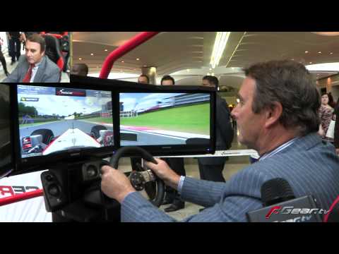 Nigel Mansell playing F1 racing video game