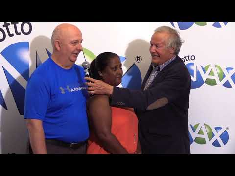 Winners pick up their $55-million Lotto Max prize