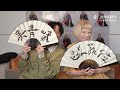 AURORA and Wu Qing Feng taking a calligraphy class