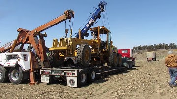 Loading a Motor Grader with a Rotator