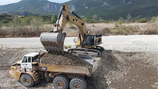 Caterpillar 374D Excavator Loading Caterpillar & Volvo Articulated Trucks - Interkat SA