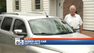Car Hit by Debris Falling off Interstate Overpass