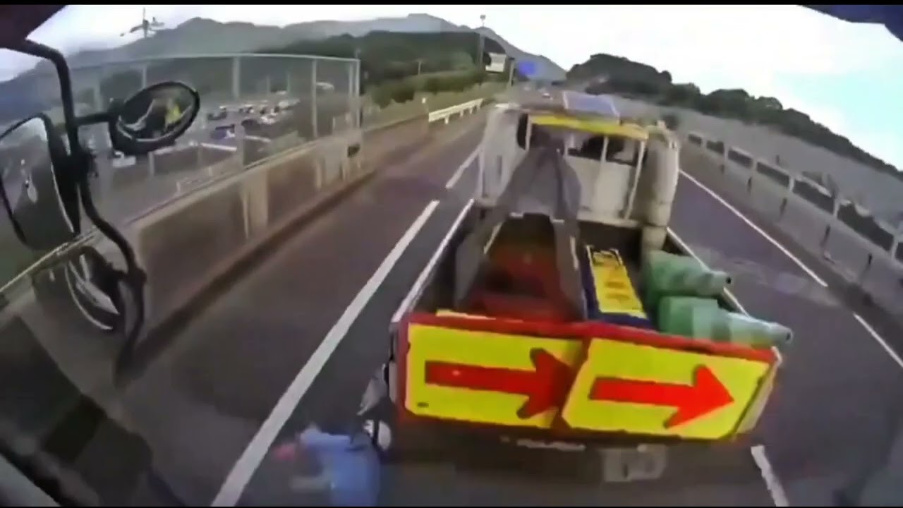 Cargo carrier hits road service vehicle 